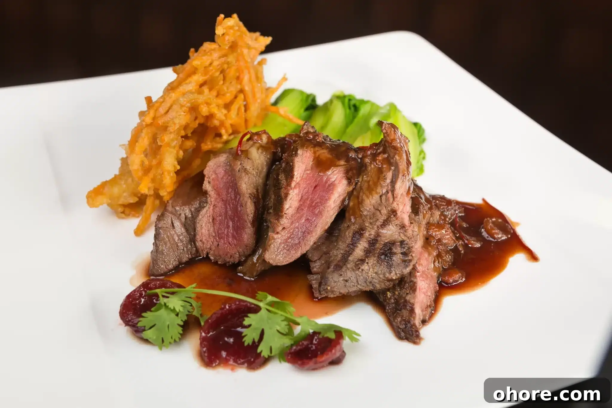 Grilled beef of kangaroo meat tenderloin served with pak choi and a rich red wine sauce.