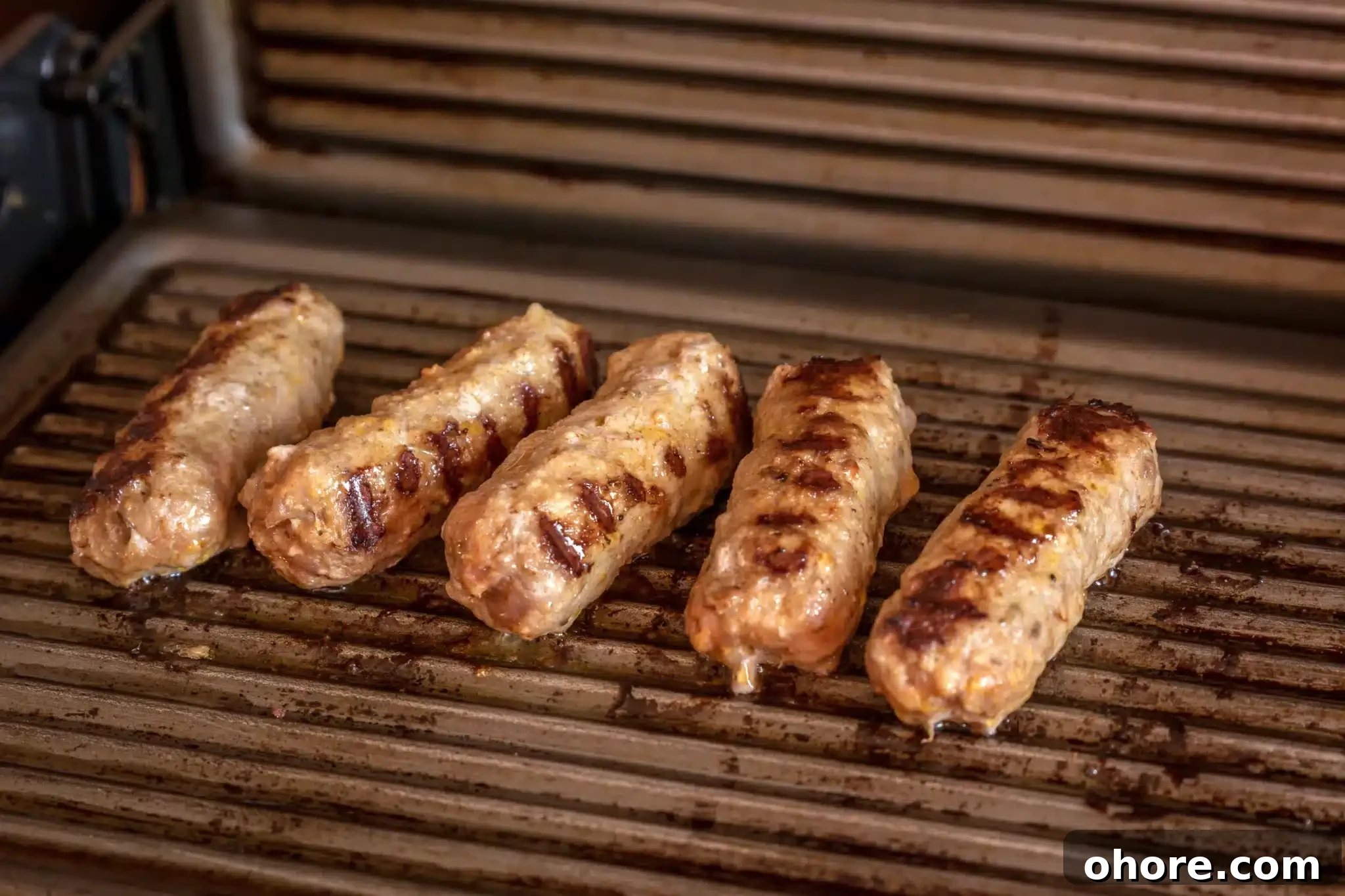 A few kebapche portions being grilled.