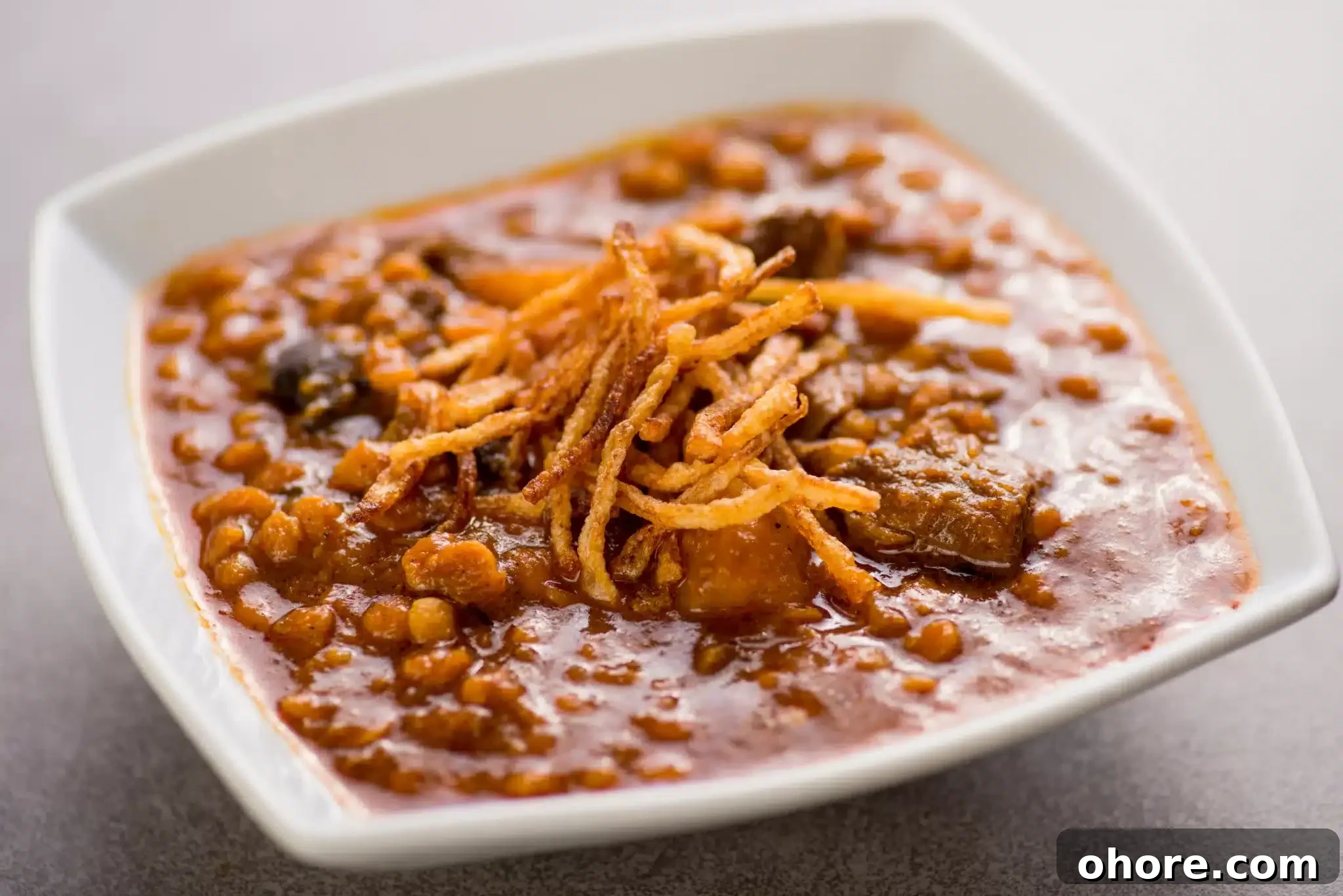 Khoresh served on square shaped plate.