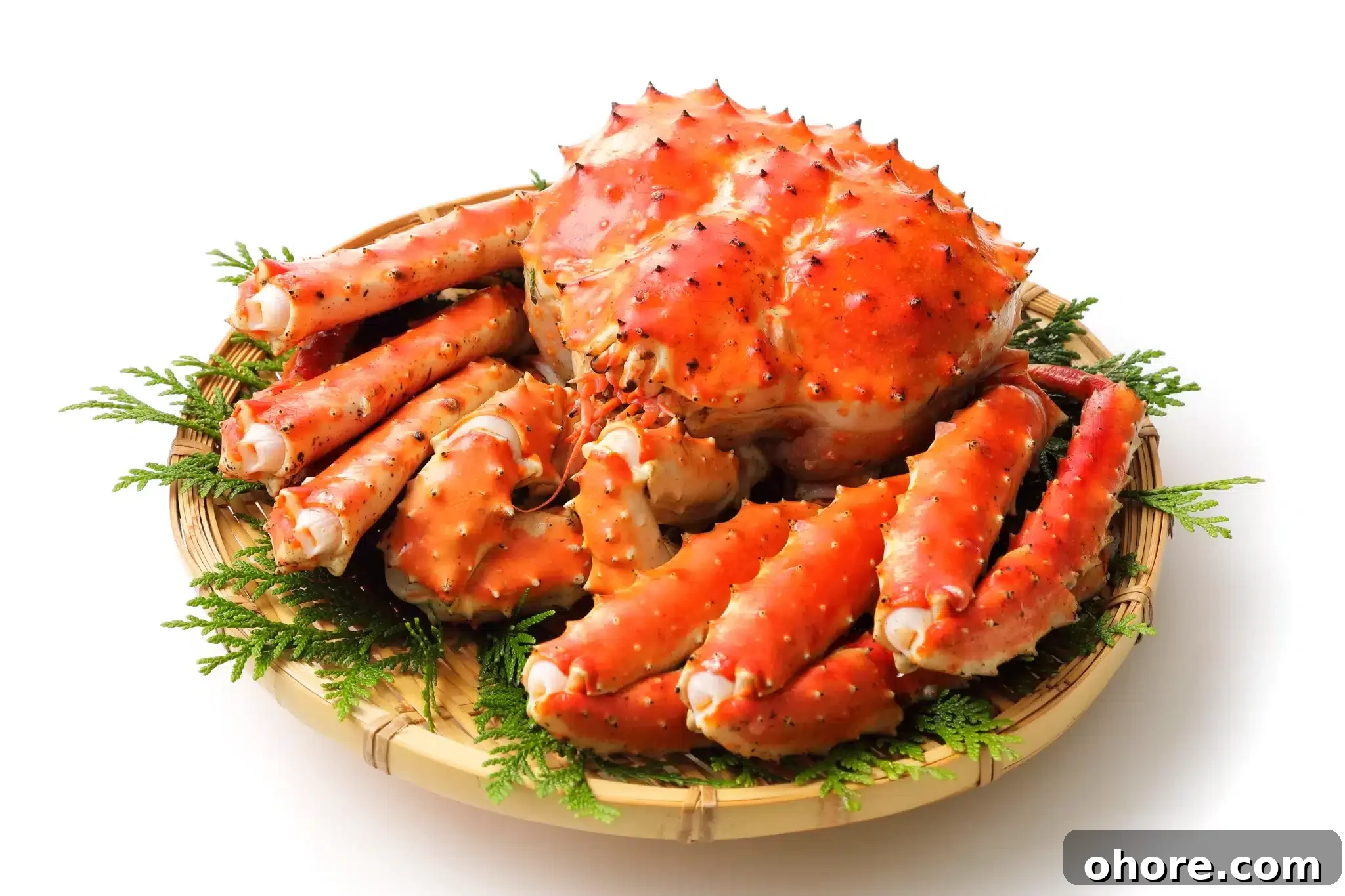 A grilled king crab resting on a handcrafted platter.