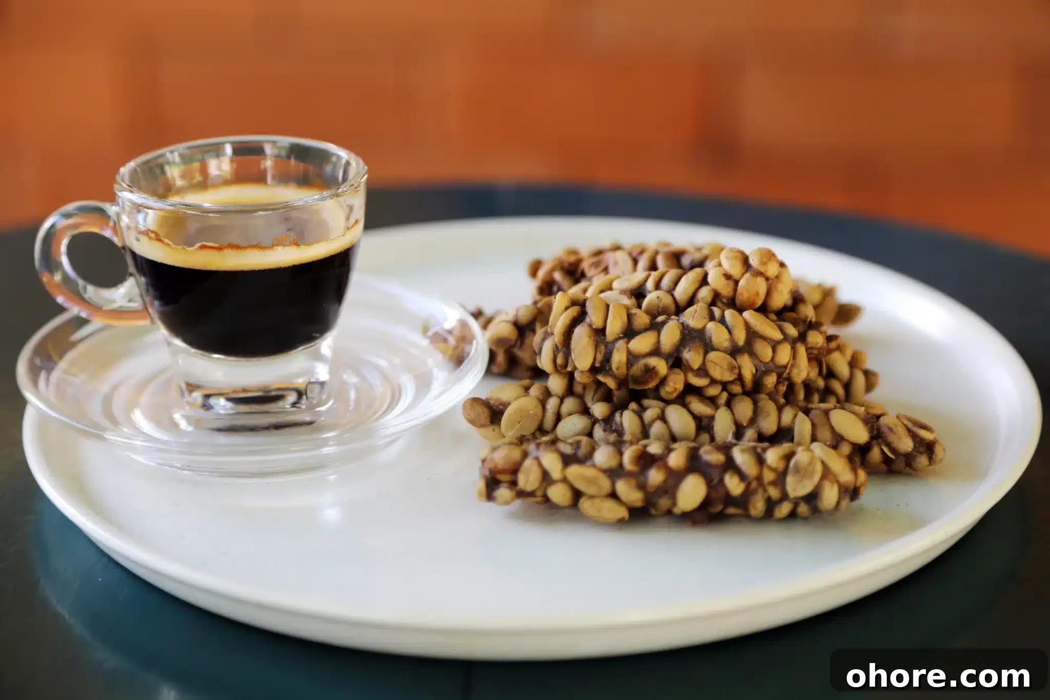 A pile of kopi luwak and a coffee prepared with that kind of beans.