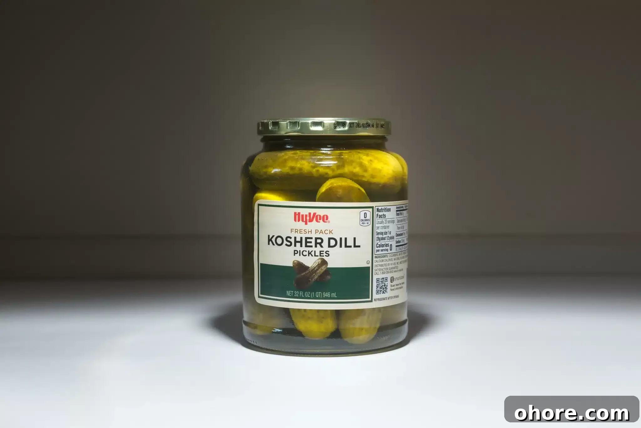 A jar of commercial kosher dill pickles.