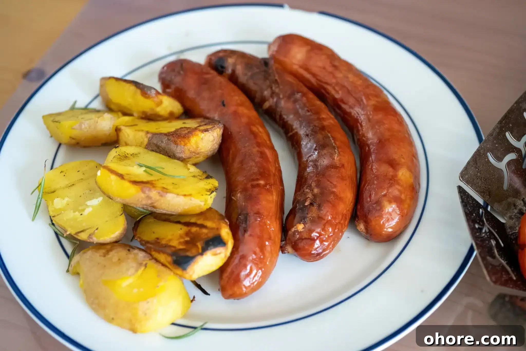 A serving of Kransky with baked potatoes ready to eat.