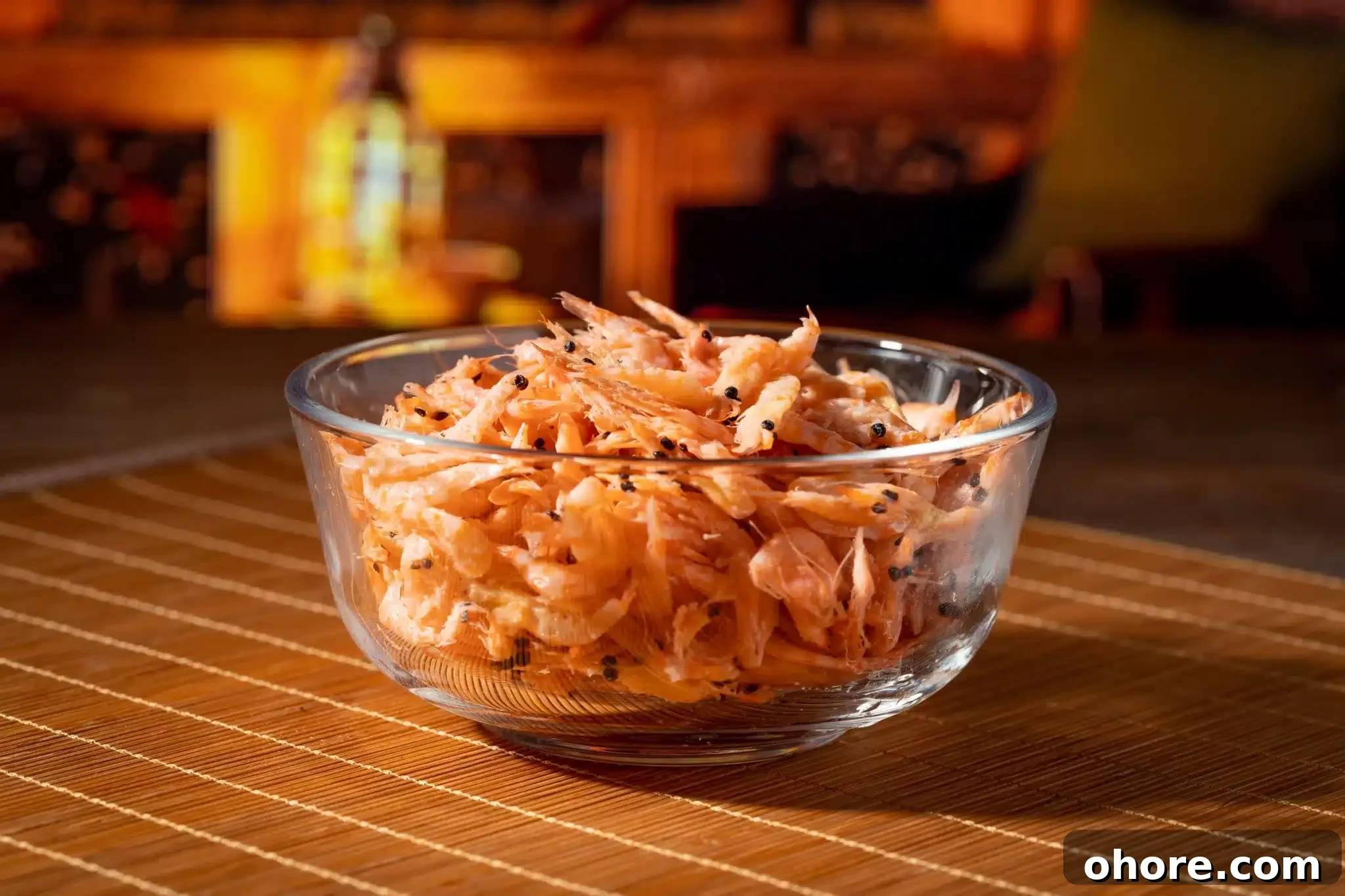 A bowl filled to the brim with krills on a kitchen blurred background.