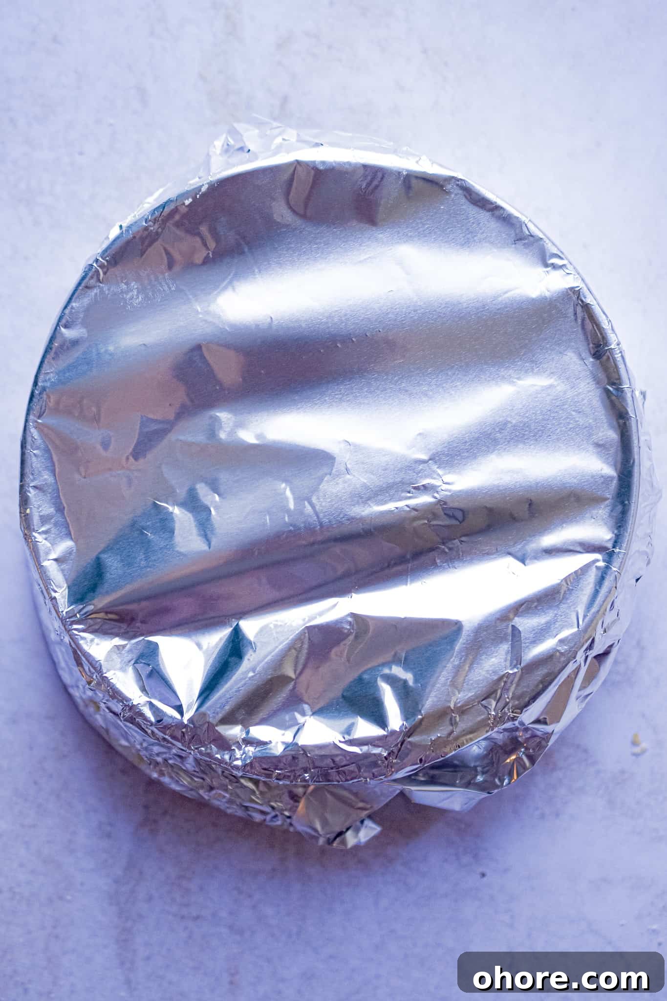 The pan is covered with aluminum foil.