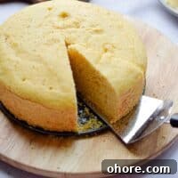 A pie server is taking a piece of the Instant Pot Cornbread.