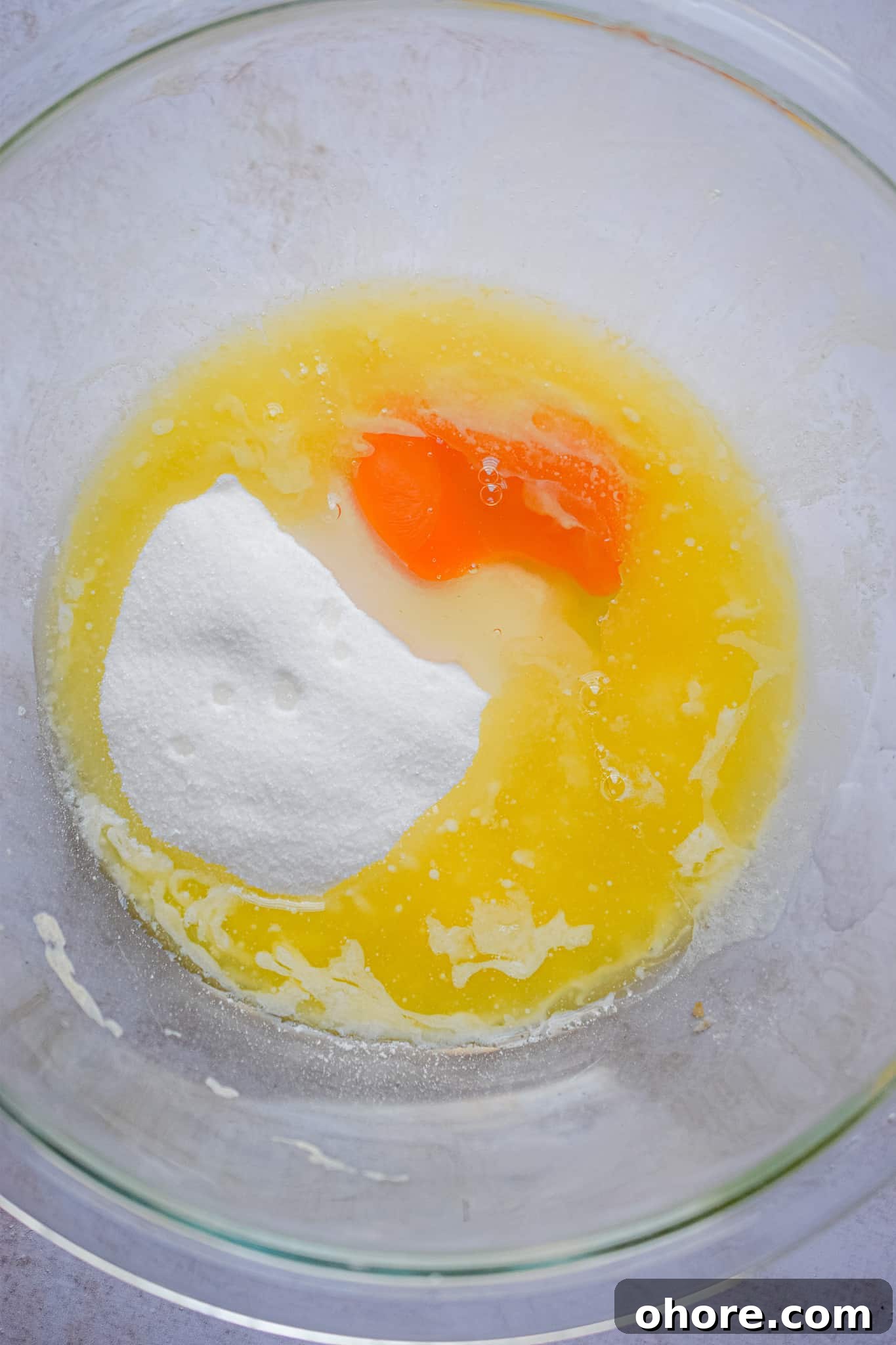 The butter, eggs, and sugar are mixed together.