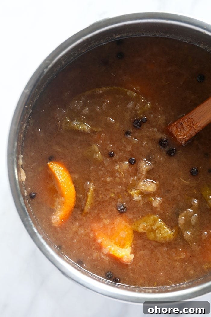 There is nothing like a big mug of hot apple cider. Make yourself some homemade apple cider this season and make it in the Instant Pot! Apple cider ingredients mashed in the Instant Pot