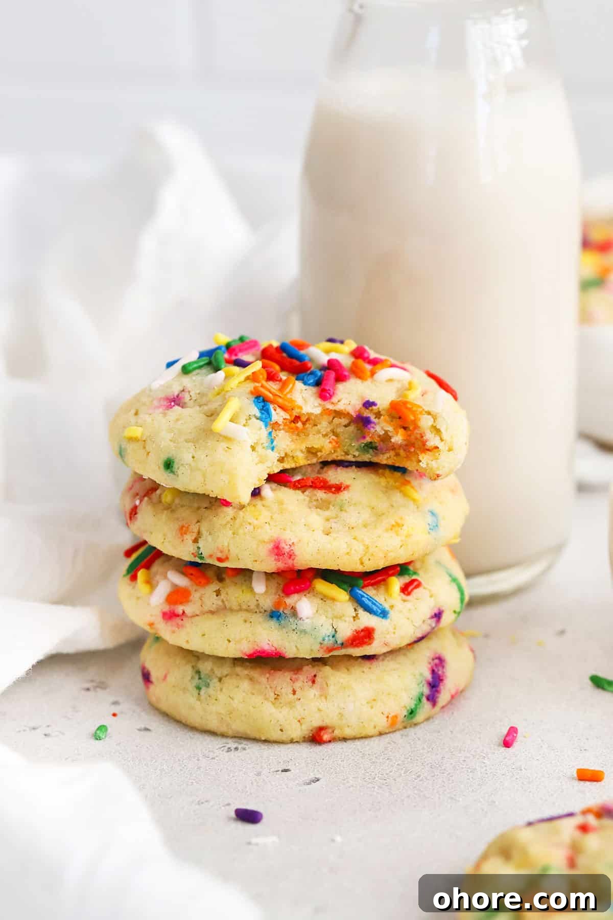 a stack of gluten-free sugar cookies with sprinkles