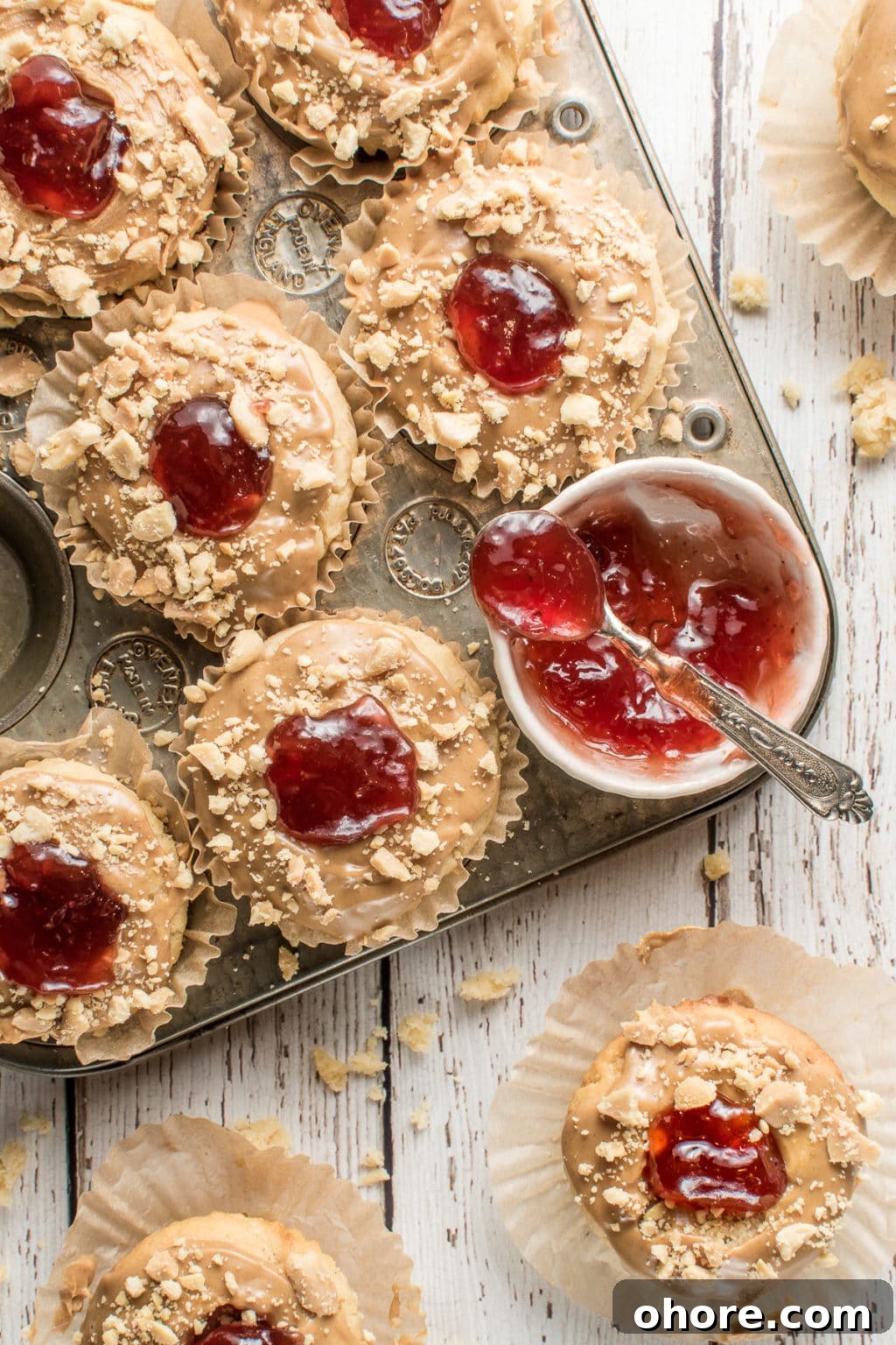Low-carb PB&J muffins with roasted strawberry jam, a nostalgic gluten-free and keto breakfast idea for all ages.The image intended to show an example of keto muffin recipes you can make on a carb restricted diet. 