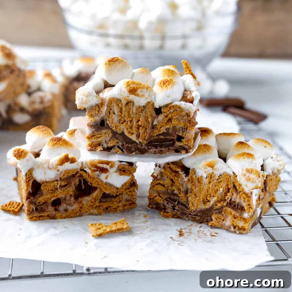 Three S'mores bars stacked on top of each other.