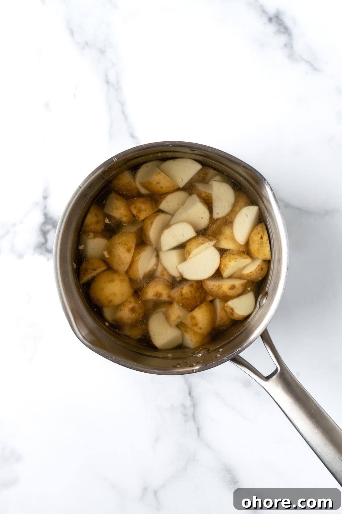 Chopped Baby Potatoes in a Pot of Water.