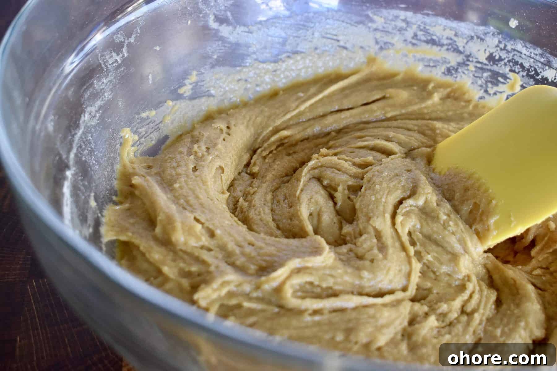 Milky Way Blondies with Caramel and Chocolate Delight 5 flour added to the mixture in the clear bowl.