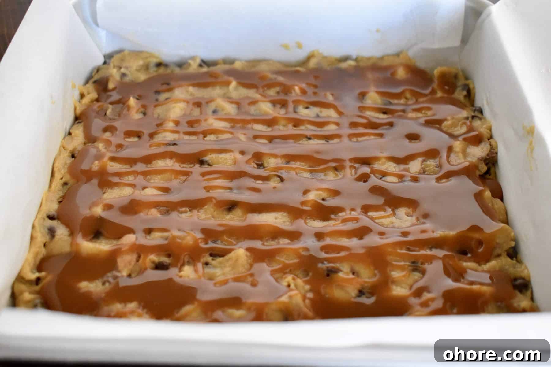 Milky Way Blondies with Caramel and Chocolate Delight 8 caramel sauce drizzled over top of the bars.