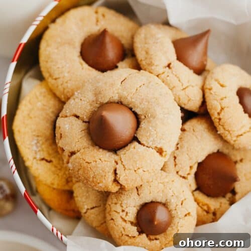 Peanut butter thumbprint cookies in a tin.