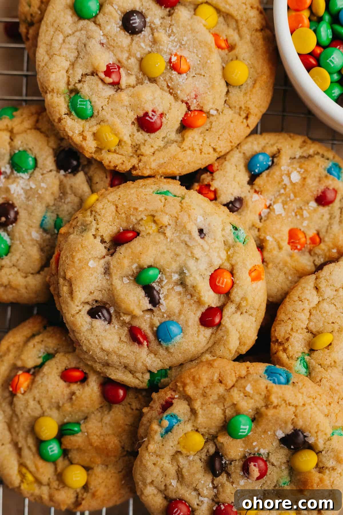 Soft Chewy Mini M&M Cookies — Small Batch Recipe 7 rainbow mini m&m cookies with a small bowl of mini m&ms