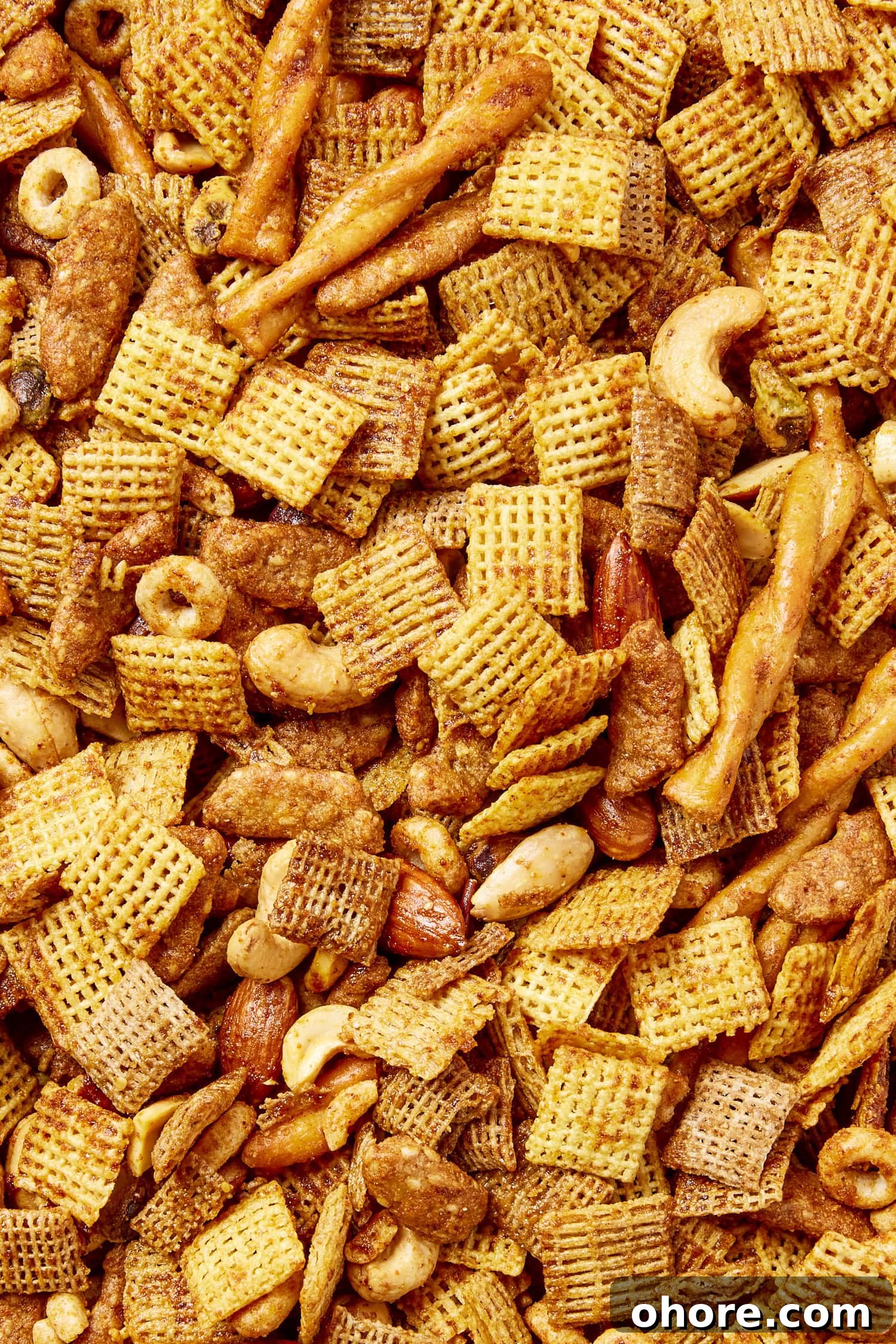 Sweet Smoky Party Snack Mix for Gatherings 3 Mixture of cereal, pretzels, and nuts to form a smoky party mix.
