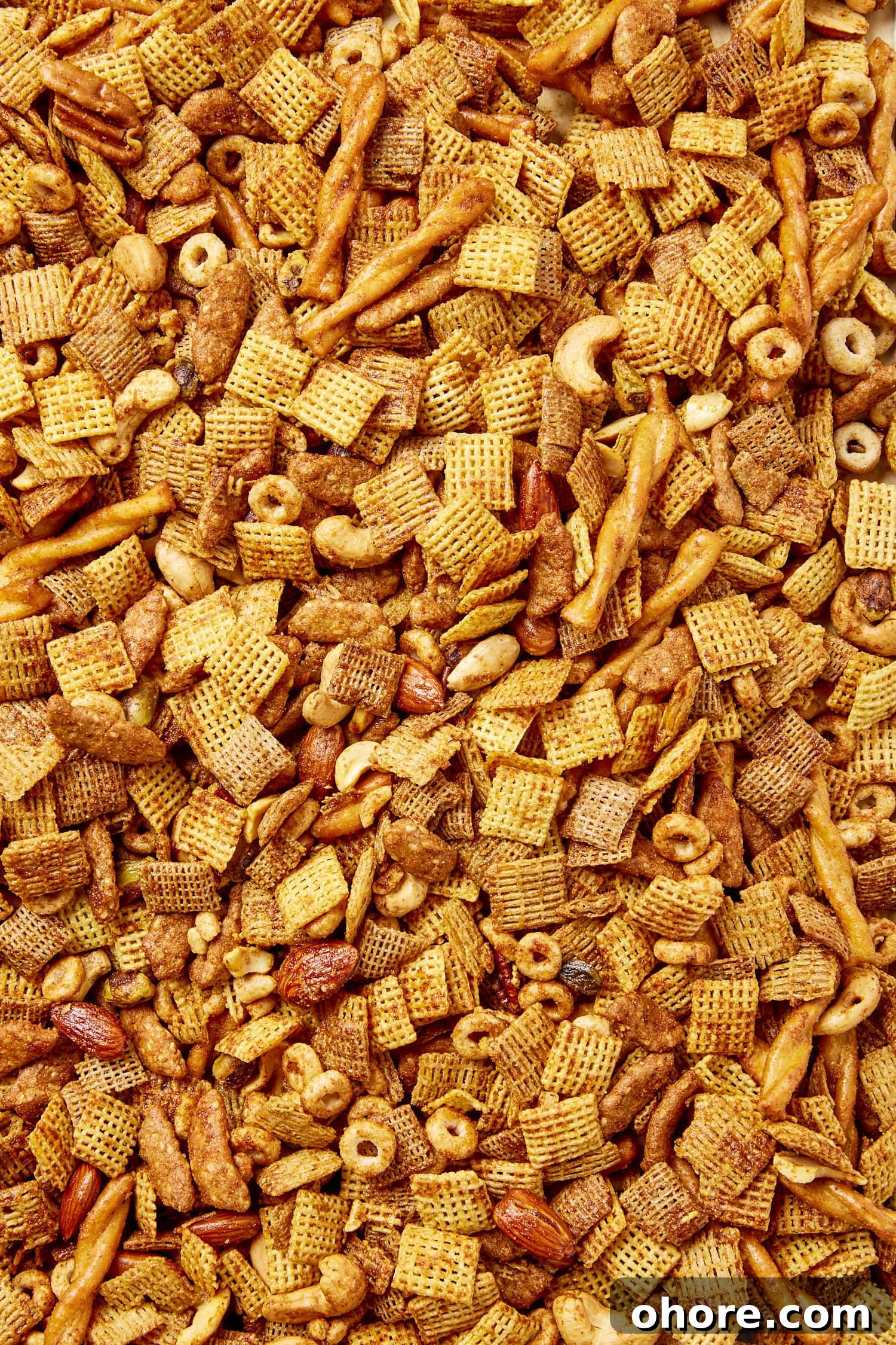 Sweet Smoky Party Snack Mix for Gatherings 5 Party mix made with cereal, nuts, and pretzels, all with a buttery coating.