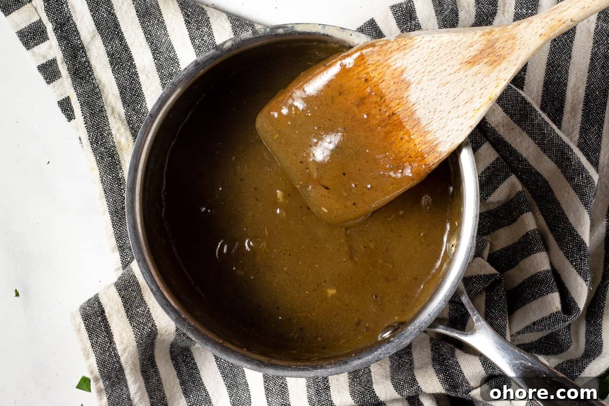 A small saucepan filled with thickened gravy 