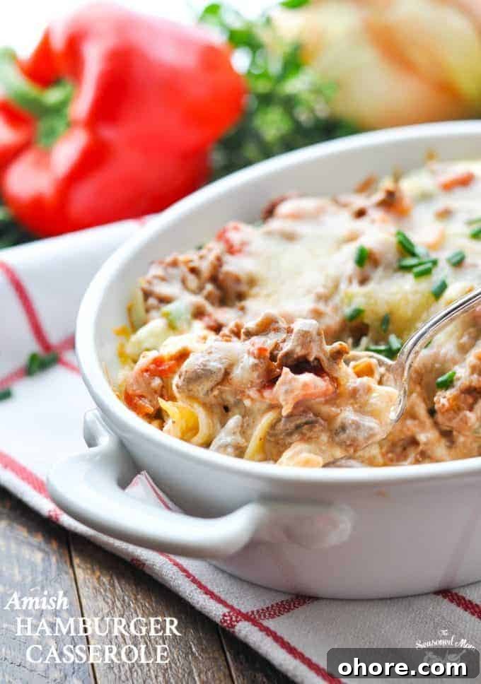 Nutritious, Low-Cost Meals to Feed Homeless Shelters and the Hungry 4 Someone spooning out casserole of food on table, red pepper in background