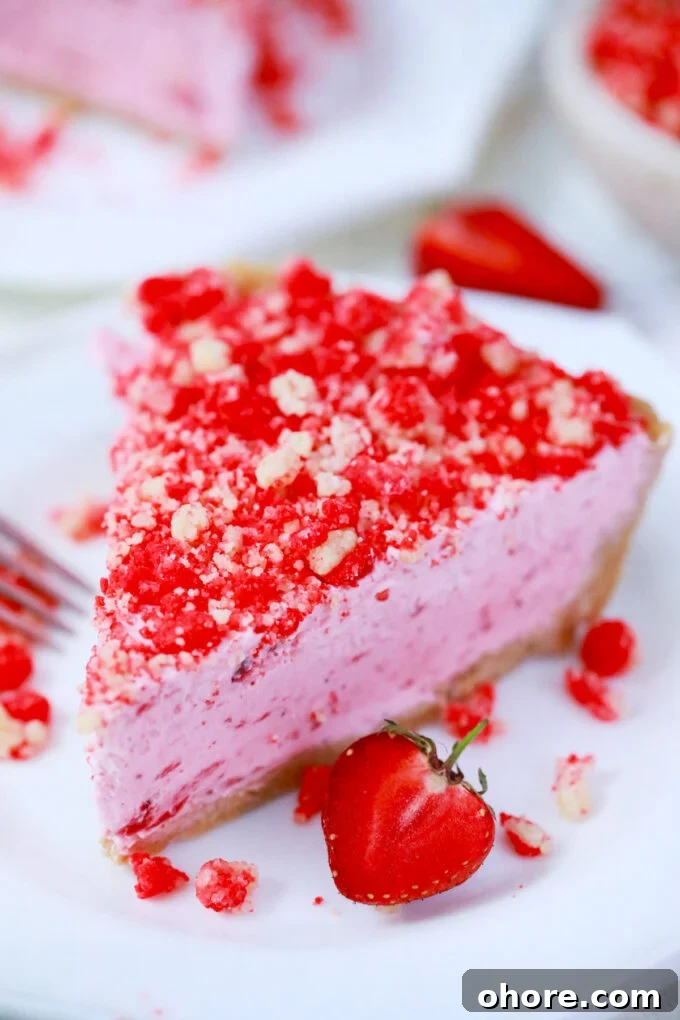 Pink strawberry shortcake pie with strawberry crumb topping.