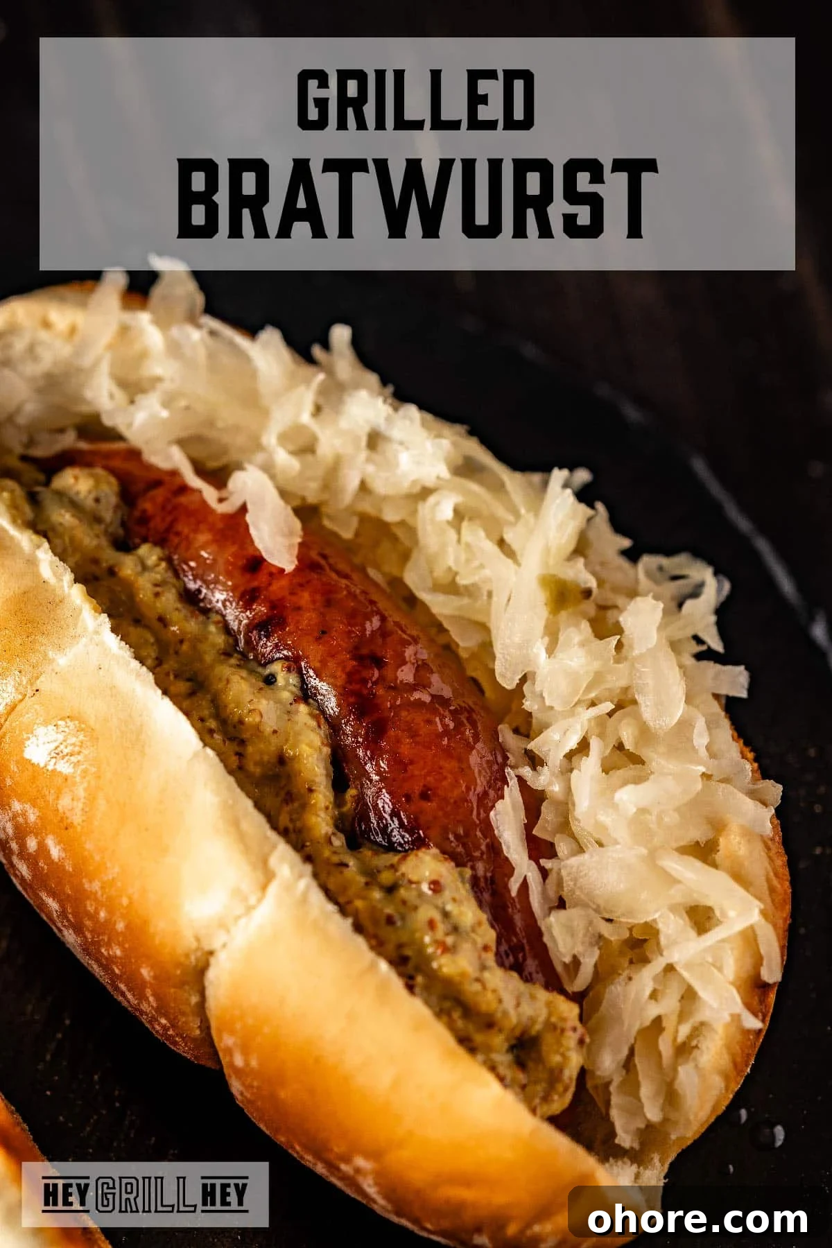 Perfectly Grilled Bratwurst: Juicy Sausage on the Grill 2 Grilled brat on a bun with sauerkraut and mustard. Text reads