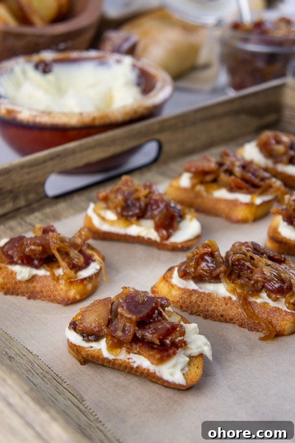 Savory Bacon Jam Crostini Recipe for Entertaining 2 bacon jam crostinis on a serving tray