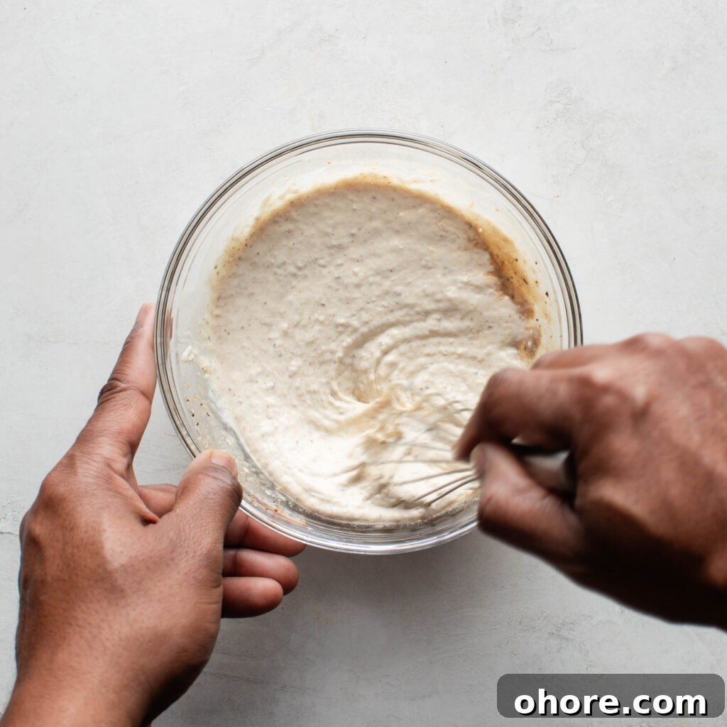 Creamy Horseradish Sauce for Prime Rib: Tangy Roast Beef Topping 5 Whisking horseradish prime rib sauce ingredients until smooth.