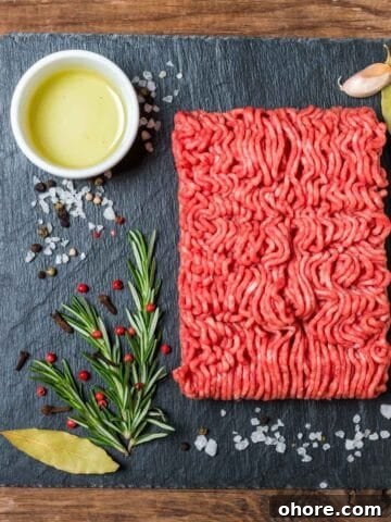 Ground meat on slate with seasonings