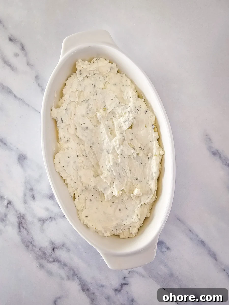 Creamy Vegetable Pizza Dip Recipe for Parties and Game Day 7 Cream cheese mixture for dip in white bowl.
