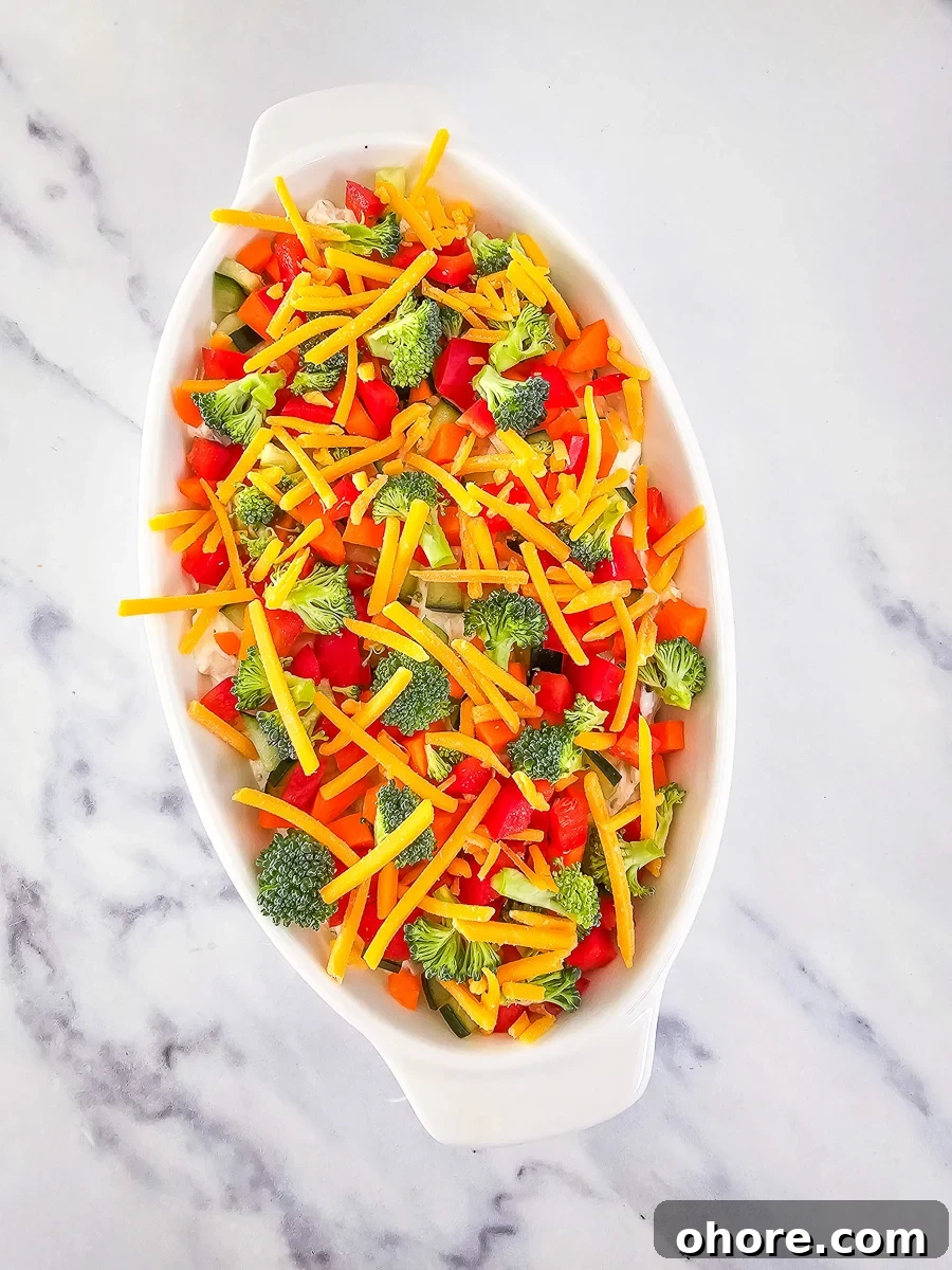 Creamy Vegetable Pizza Dip Recipe for Parties and Game Day 10 Veggie pizza dip in white bowl.
