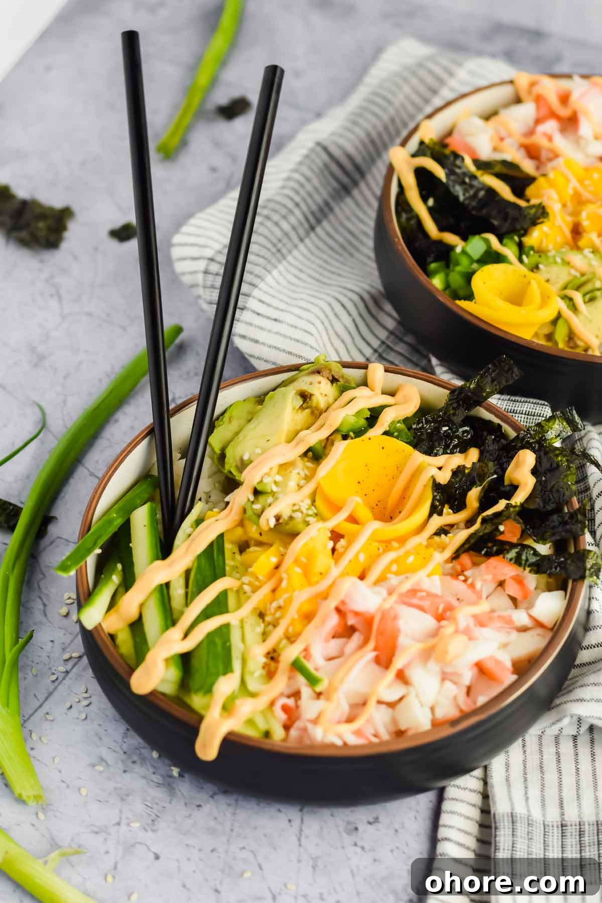 California Roll Bowl Recipe: Sushi-Inspired Deconstructed Bowl Guide 2 two California roll poke bowls drizzled with spicy mayo.