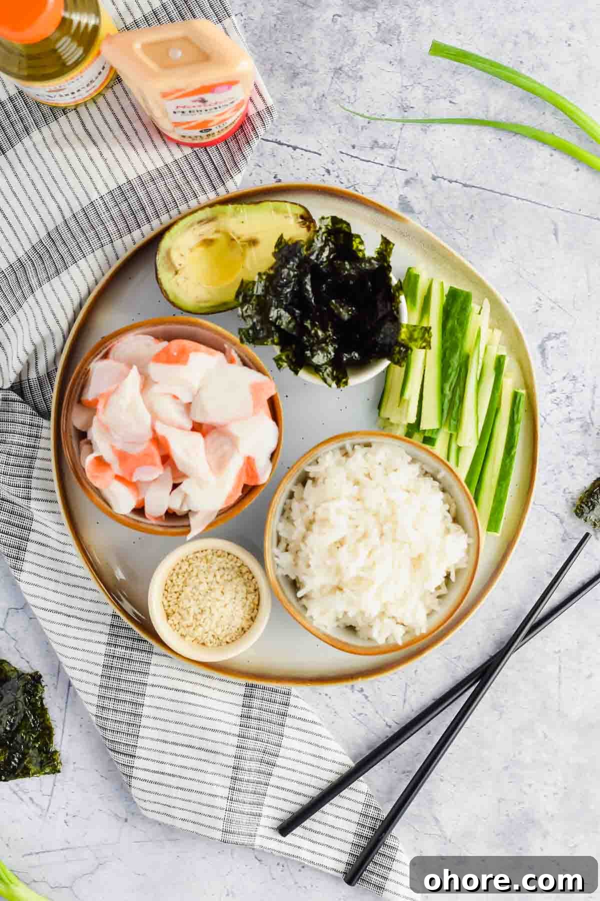 California Roll Bowl Recipe: Sushi-Inspired Deconstructed Bowl Guide 5 ingredients for california roll bowls separated on plate.