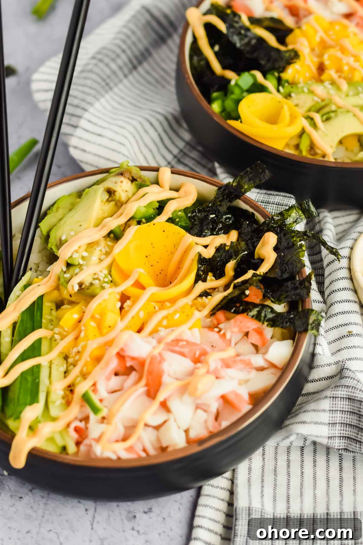 California Roll Bowl Recipe: Sushi-Inspired Deconstructed Bowl Guide 8 two california roll poke bowls drizzled with spicy mayo.