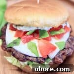 Grilled Caprese Burger Recipe with Fresh Mozzarella & Basil 3 Caprese Burger with mozzarella, tomato, basil.
